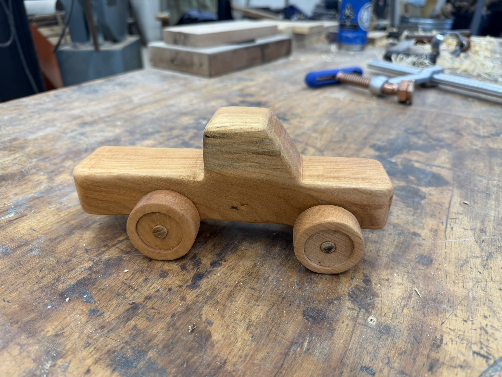Handcrafted wooden pickup truck, viewed from the side